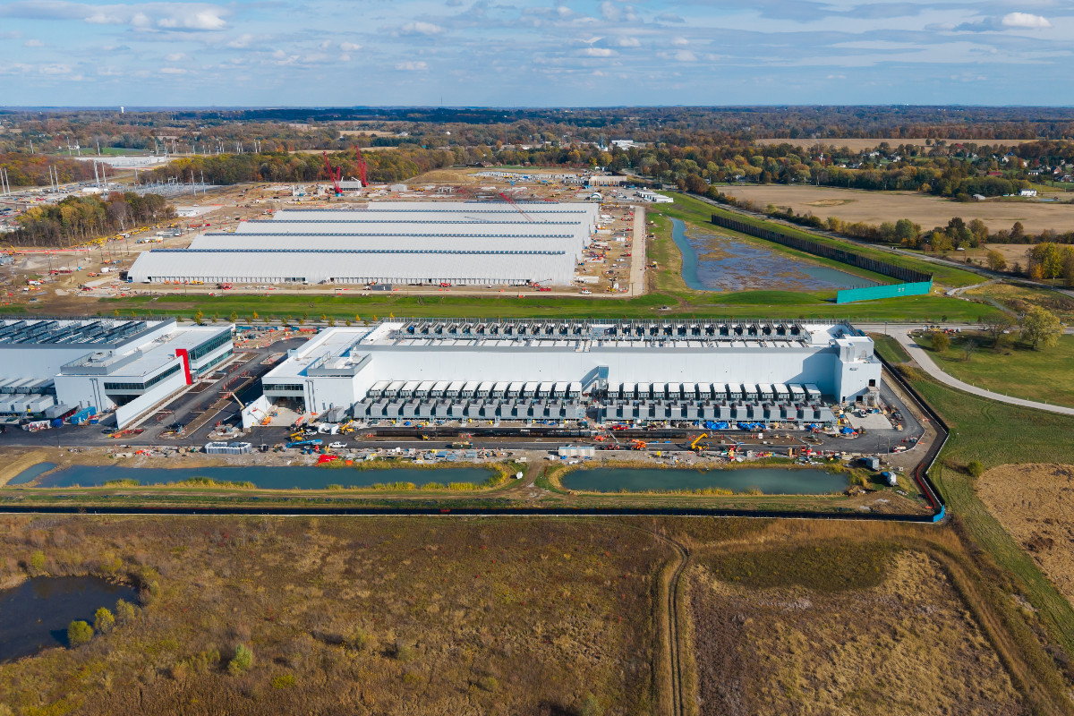 Aerial view of a large data centre campus under construction.